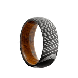 Damascus Steel domed men's wedding band in an acid wash featuring a Desert Iron Wood sleeve.