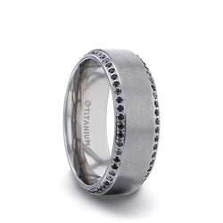 Titanium men's wedding ring with brushed center featuring a bevel eternity arrangement of black sapphires