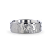 Titanium wedding ring with raised hammered center and polished step edges. 