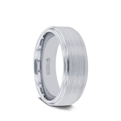 Tungsten men's wedding ring with raised, brushed center and polished step edges.