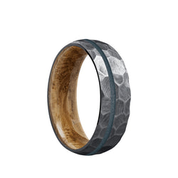 Tantalum domed men's wedding band with 1mm off center Blue Titanium colored and rock satin finish featuring a whiskey barrel sleeve.
