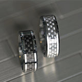 Tungsten wedding band with beveled edges and white carbon fiber inlay