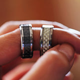Tungsten wedding band with beveled edges and black carbon fiber inlay