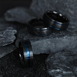 Black Titanium men's wedding ring with brushed center, blue grooves and carved...