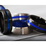 Black Ceramic men's wedding ring with polished blue stripe and beveled edges